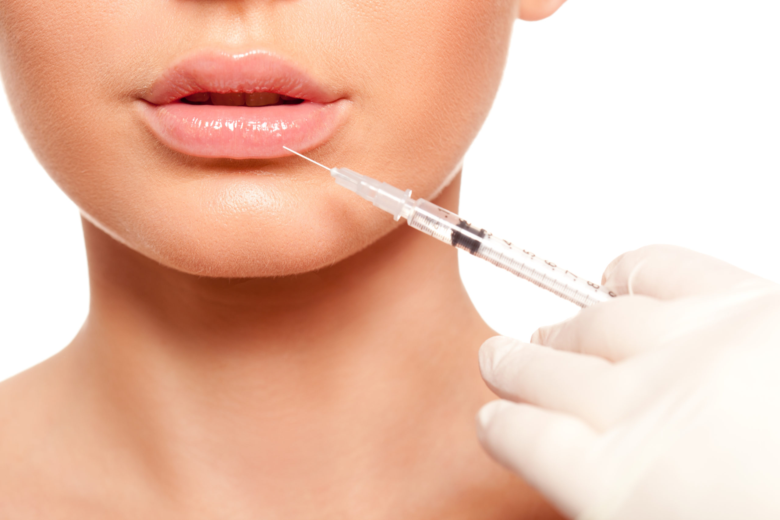 Young woman getting injection on Lips | Aviva Med Spa in Centennial, CO