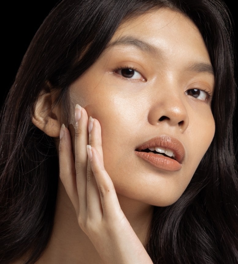 Close up portrait of gorgeous young Asian beautiful woman with perfect glowing skin, dark hair and minimal nude makeup. Wrinkle Relaxers, Aviva Med Spa Centennial CO.